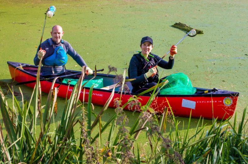 river clean up litter pickers in kayak